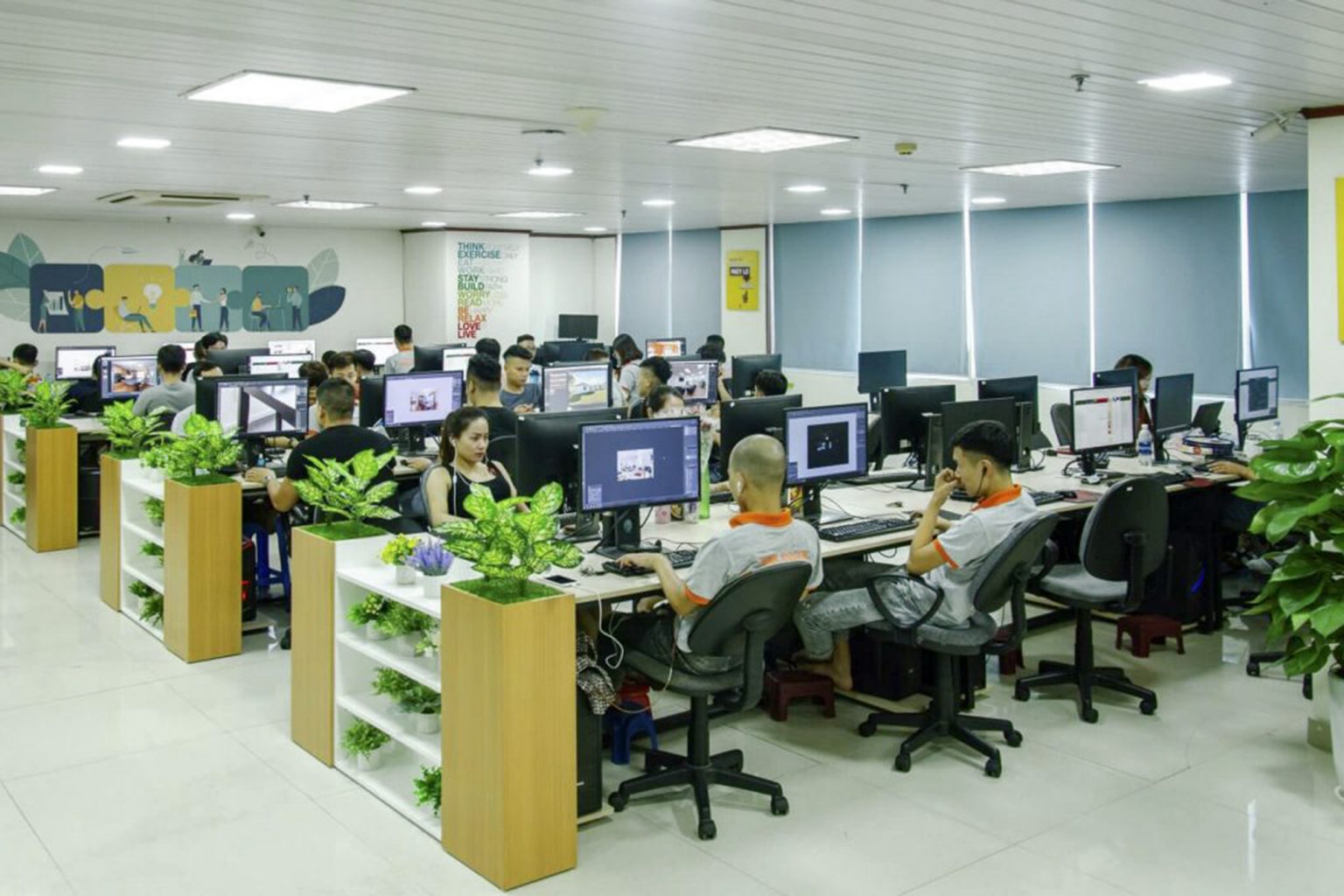 Rows of editing workstations in the Beepec office