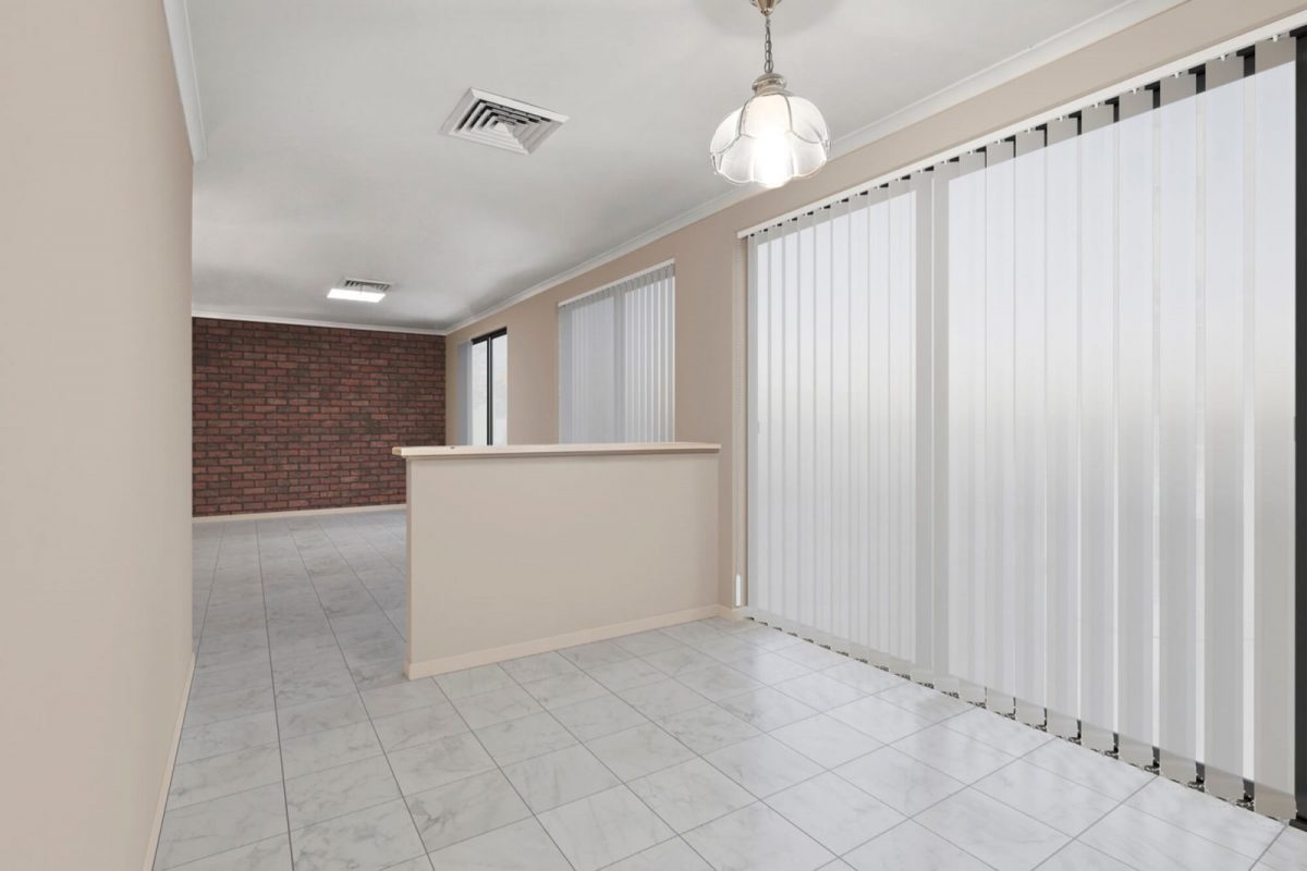 The same room after item removal, cleared to an empty tiled floor