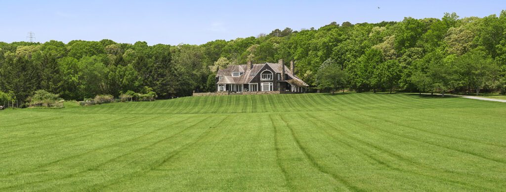 Freshly mown green lawn in front of a house